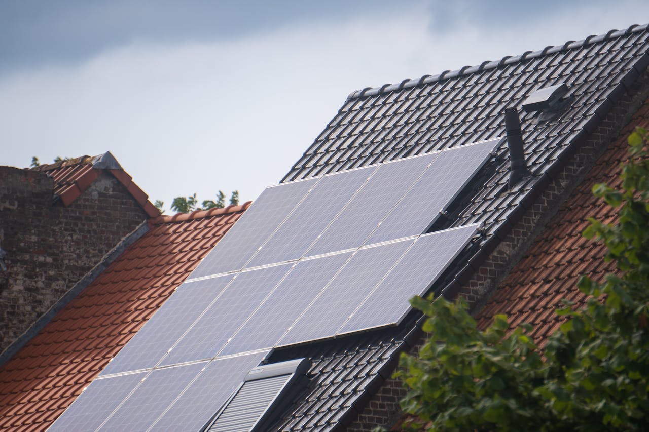 Contact Solar panels installed on a residential rooftop, showcasing eco-friendly renewable energy solutions.
